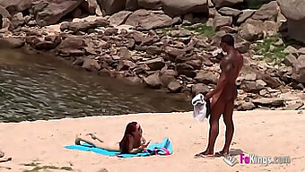 Well-Endowed Black Man Attracts A Nudist Beach Babe