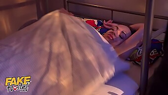 A Young Girl Experiences Double Penetration With Two Large Penises In A Faux Hostel Setting.